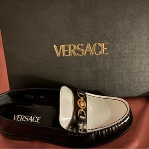 Versace women’s Black and White Loafers with Gold Accent